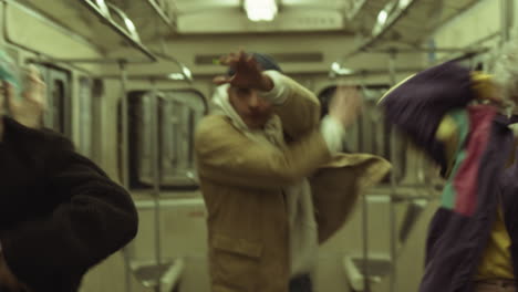 Group-of-Young-Stylish-People-Dancing-in-Subway-Train