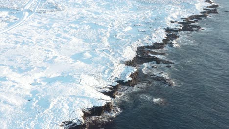 stunning coastline of reykjanes peninsula in iceland covered in white snow