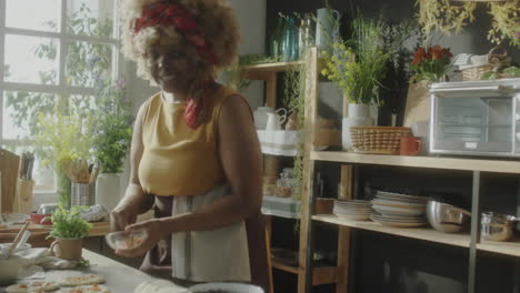 woman cooking and preparing food in a kitchen