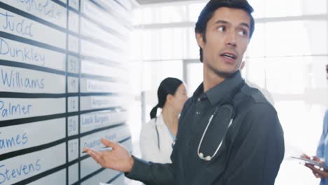 Doctors-in-discussion-at-a-whiteboard-in-an-office-4k