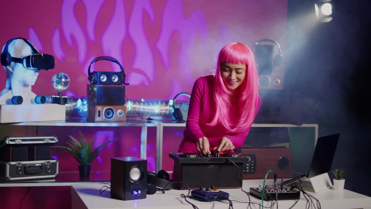 Woman DJ with Pink Hair Performing in a Nightclub