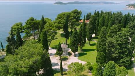 aerial view of gazebo surrounded by cypress trees on a sunny day