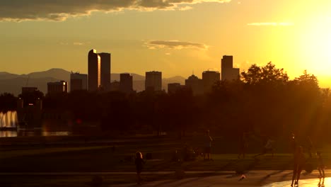 denver skyline against a background of sunset and orange sky