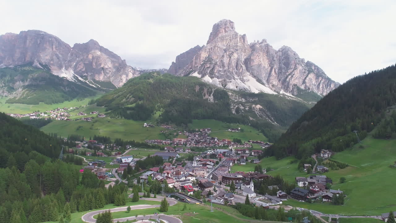 Cyclist Riding on a Road in the Dolomites, Italy, from a Drone