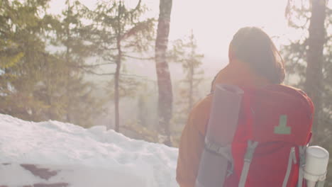 couple hiking in mountains on winter day