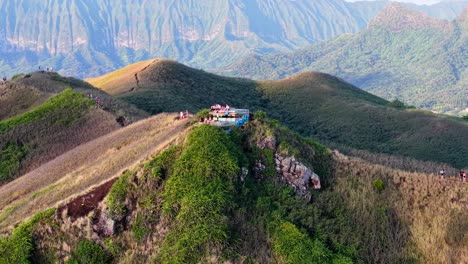Crowd of hikers on a pillbox overlook at Ko'olau Mountains in Oahu, Hawaii, Aerial