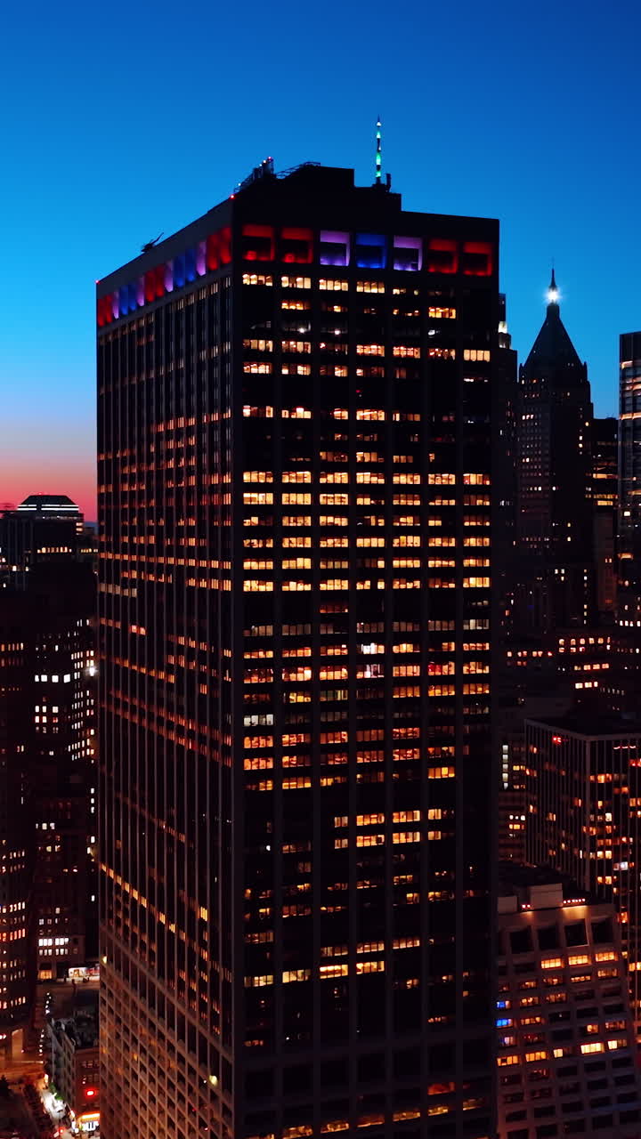 Manhattan street with night lights. Nightlife of New York city aerial view. Vertical video