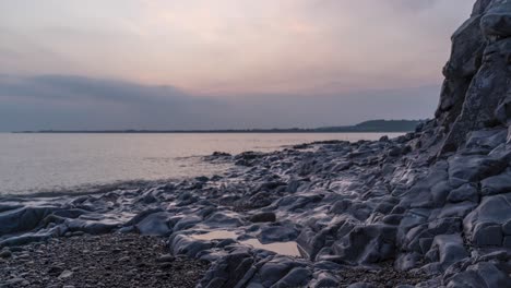 Timelapse-De-La-Puesta-De-Sol-Debajo-Del-Horizonte-A-Través-Del-Mar-En-Ogmore-On-Sea,-Sur-De-Gales,-Reino-Unido