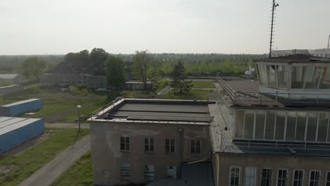 drone circling around an abandoned german guardhouse with many windows