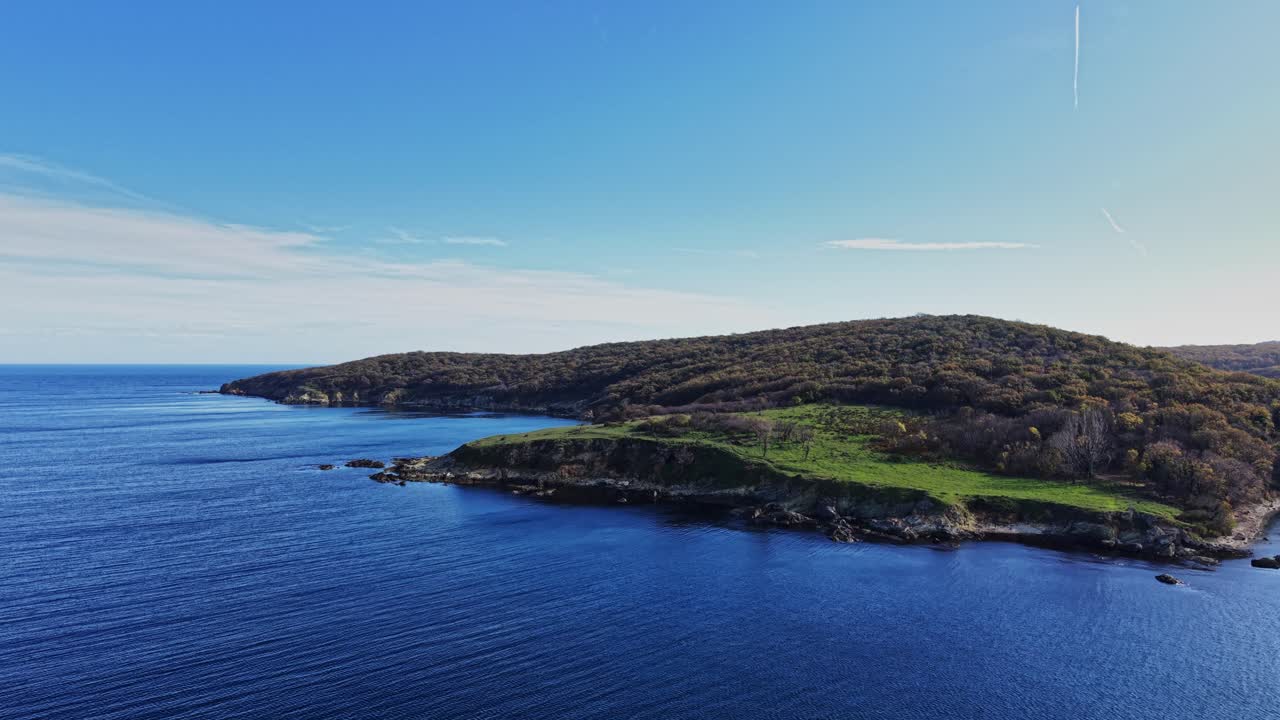 Aerial view of a peaceful coastal landscape on a sunny day