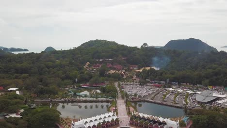 aerial landscape drone shot of a touristic place on a tropical island in malaysia. eagle square langkawi