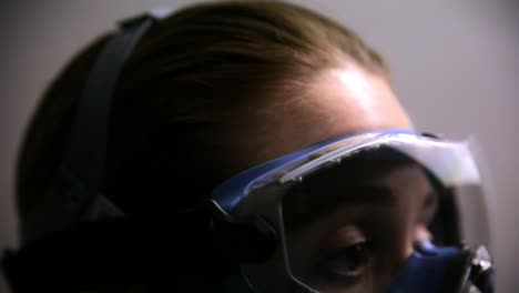 Close-Up-Coronavirus-Scientist-Doctor-Victim-wearing-Face-Mask-Respirator-and-Safety-Goggles