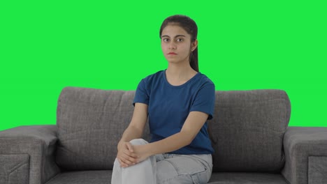 Indian-teenage-girl-looking-to-the-camera-Green-screen