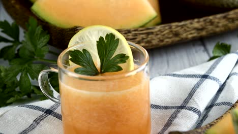 whole and sliced of japanese melons,honey melon or cantaloupe (cucumis melo) glass of melon smoothie healthcare concept.