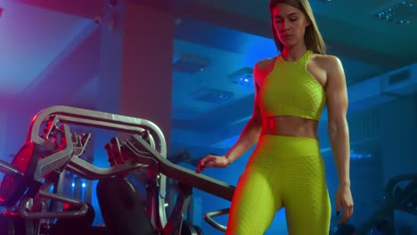 woman doing chest press in a gym