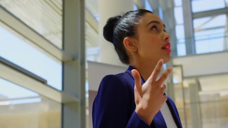 mixed-race businesswoman practicing speech in the office 4k