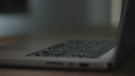 close up hand of a business woman typing keyboard laptop computer on desk office