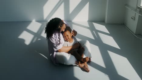 mother and child in a sunny room