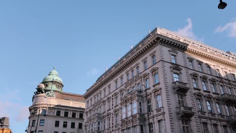 elegant historic buildings in vienna, austria, under a bright blue sky