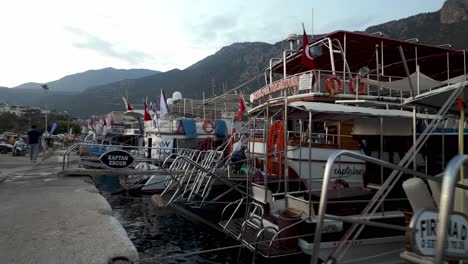 turkish boats docked in harbor at sunset