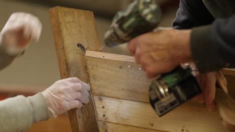 securing wood trim on boat bow with power drill