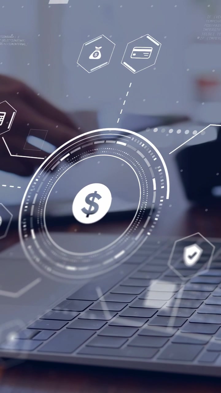 Vertical video: Hand tilting phone over keyboard, HUD centering dollar, linking hex finance icons