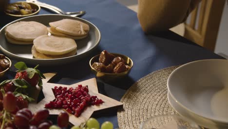 muslim family table at home set for iftar meal breaking daily fast during ramadan 3