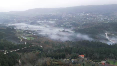 fog-enshrouded landscape in marco de canavezes, porto portugal