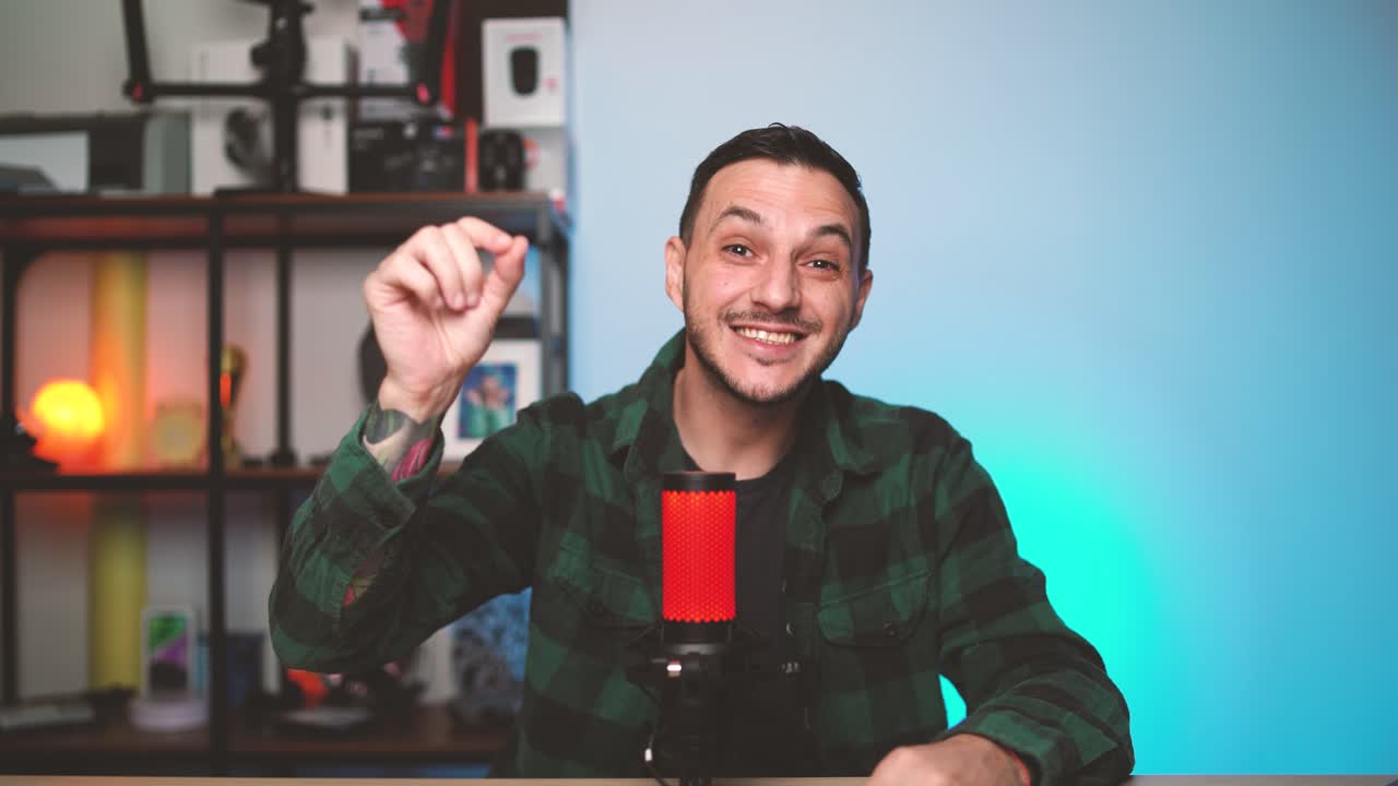 Male content creator bursts into a podcast studio with exaggerated movements and a playful mood, bringing humor and excitement to his vlogging intro.