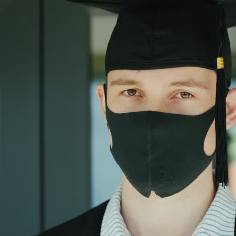 Graduate-In-A-Protective-Mask-And-Cap-Graduating-From-College-Under-Quarantine