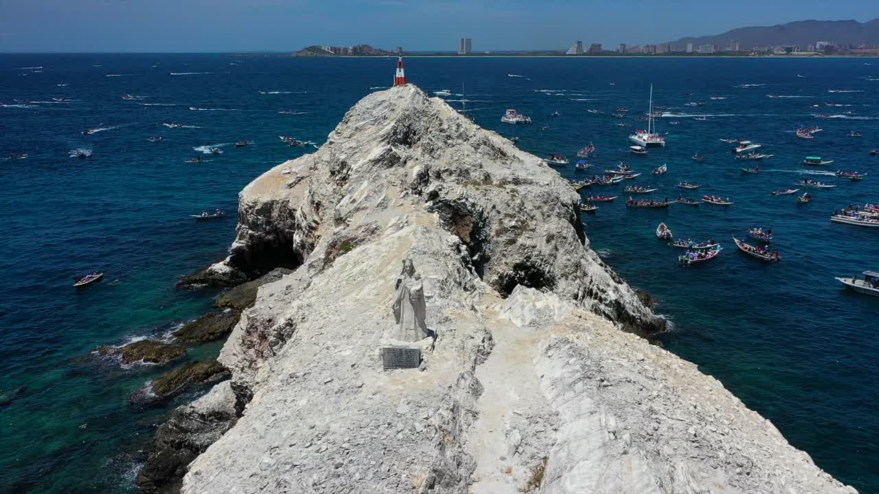 Boats and statue during religious sea procession in Venezuela's Margarita Island