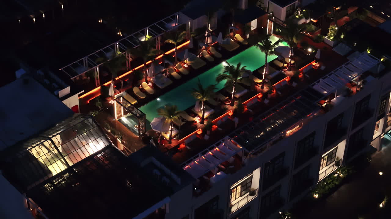 Aerial footage showing Pantai Berawa resort illuminated at night