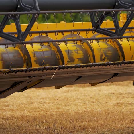 harvester mower mechanism on field. combine harvester moves on field. agricultural harvesting works. large harvester during seasonal works. agricultural business
