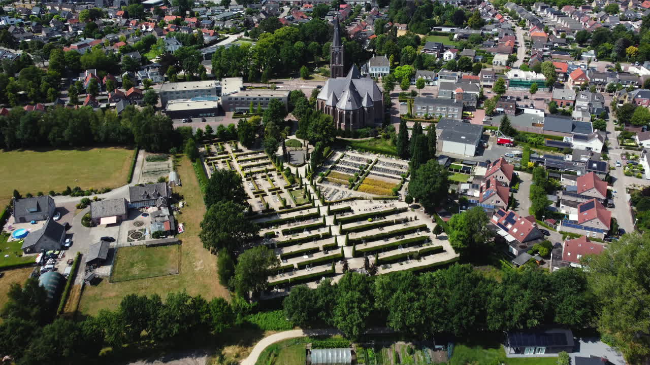 Aerial View of a Dutch Town with Church and Cemetery