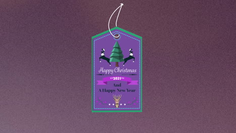 animation of christmas greetings on tag over dark background