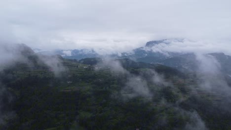 Through-the-clouds,-I-saw-a-small-mountain-village