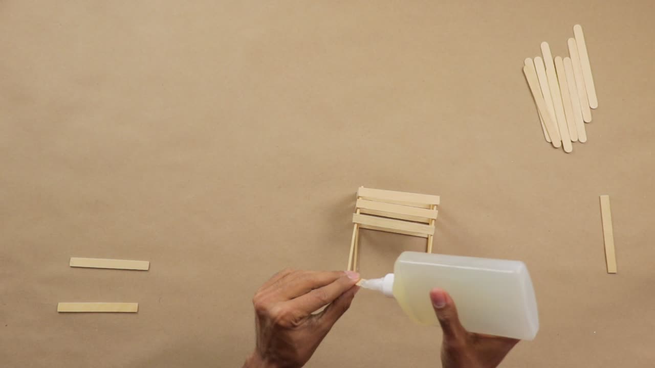 Making creative do it yourself crafts with glue and popsicle sticks