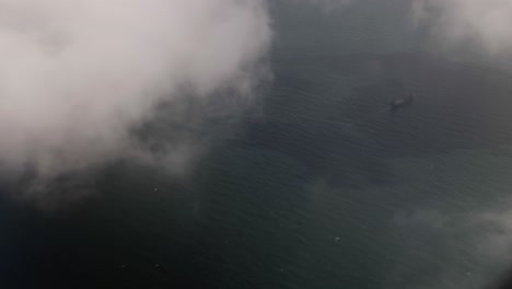 Aerial-view-from-airplane-of-clouds,-Gulf-of-Oman,-ocean,-cloudy-sky-near-Dubai