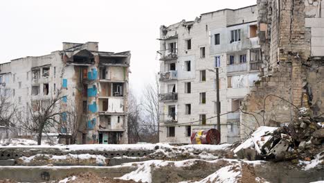 on a winter day in irpin, ukraine, a destroyed civilian neighborhood remains after intense battles between ukrainian and russian forces during the ongoing war.