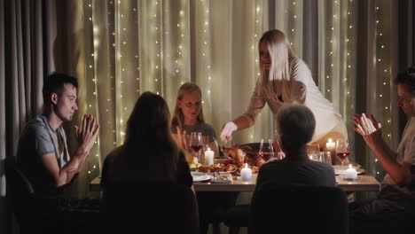 woman serving a turkey to the festive table