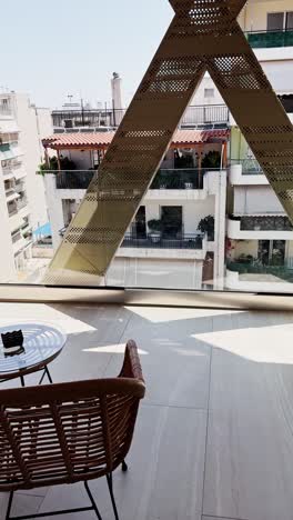 hand opening balcony door to outside view