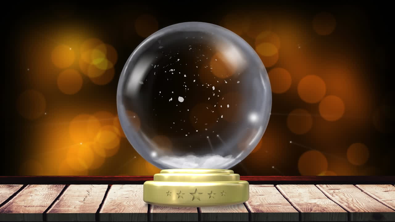 스노우가 떨어지고 스포트라이트가 배경인 크리스마스 스노우 글로브의 애니메이션