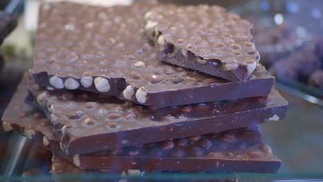 stacked artisan chocolate bars with nuts