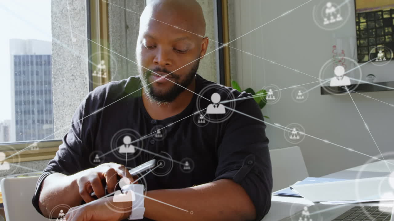 Animation of networks of connections with icons over man using smartphone