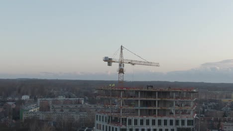 drone shot of construction of paju 2 in tartu, estonia with boat on the turusild bridge