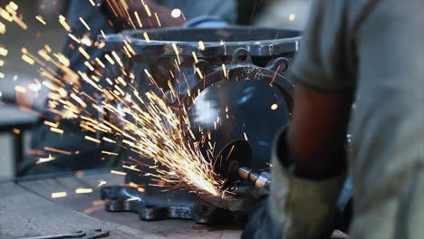 workers wearing industrial uniforms and welded iron mask at steel welding plants, industrial safety first concept