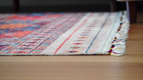 colorful patterned rug on wooden floor