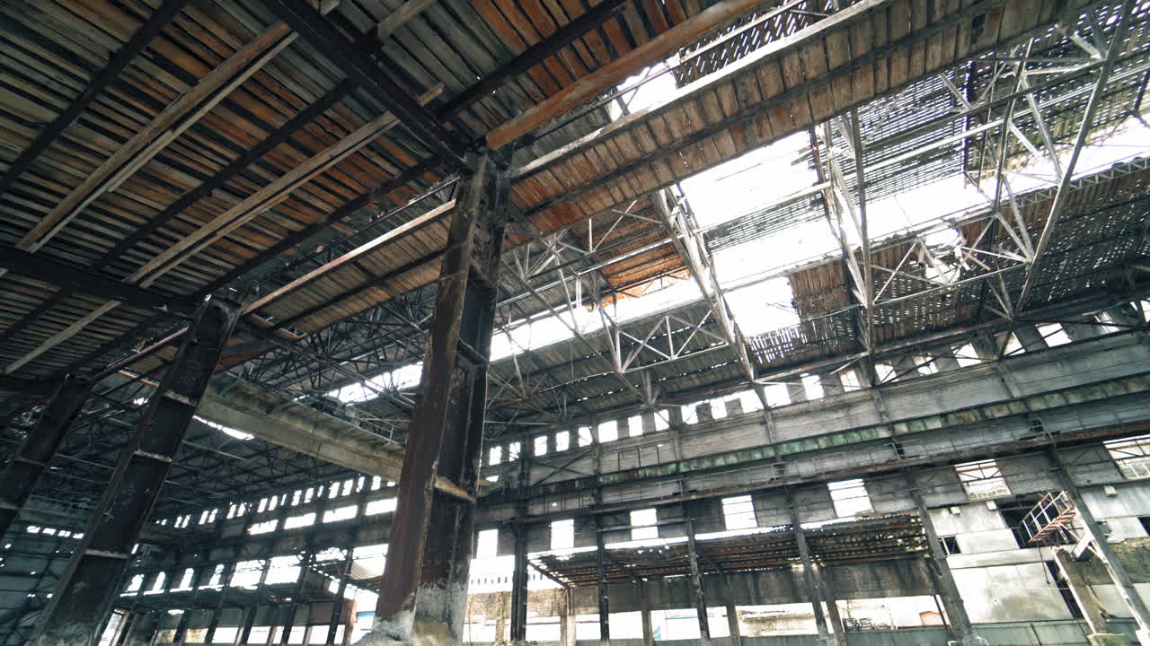 Inside old ruined building with collapsed roof and overgrown with grass, catastrophe or earthquake consequences, toned