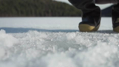 removing scrapings with ice scoop from ice hole