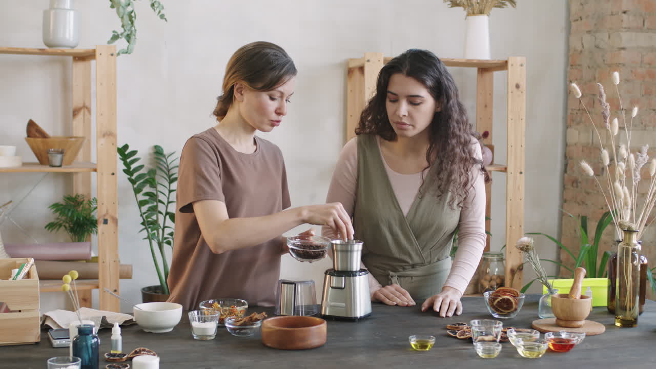 Women Grinding Coffee Beans In Blender
